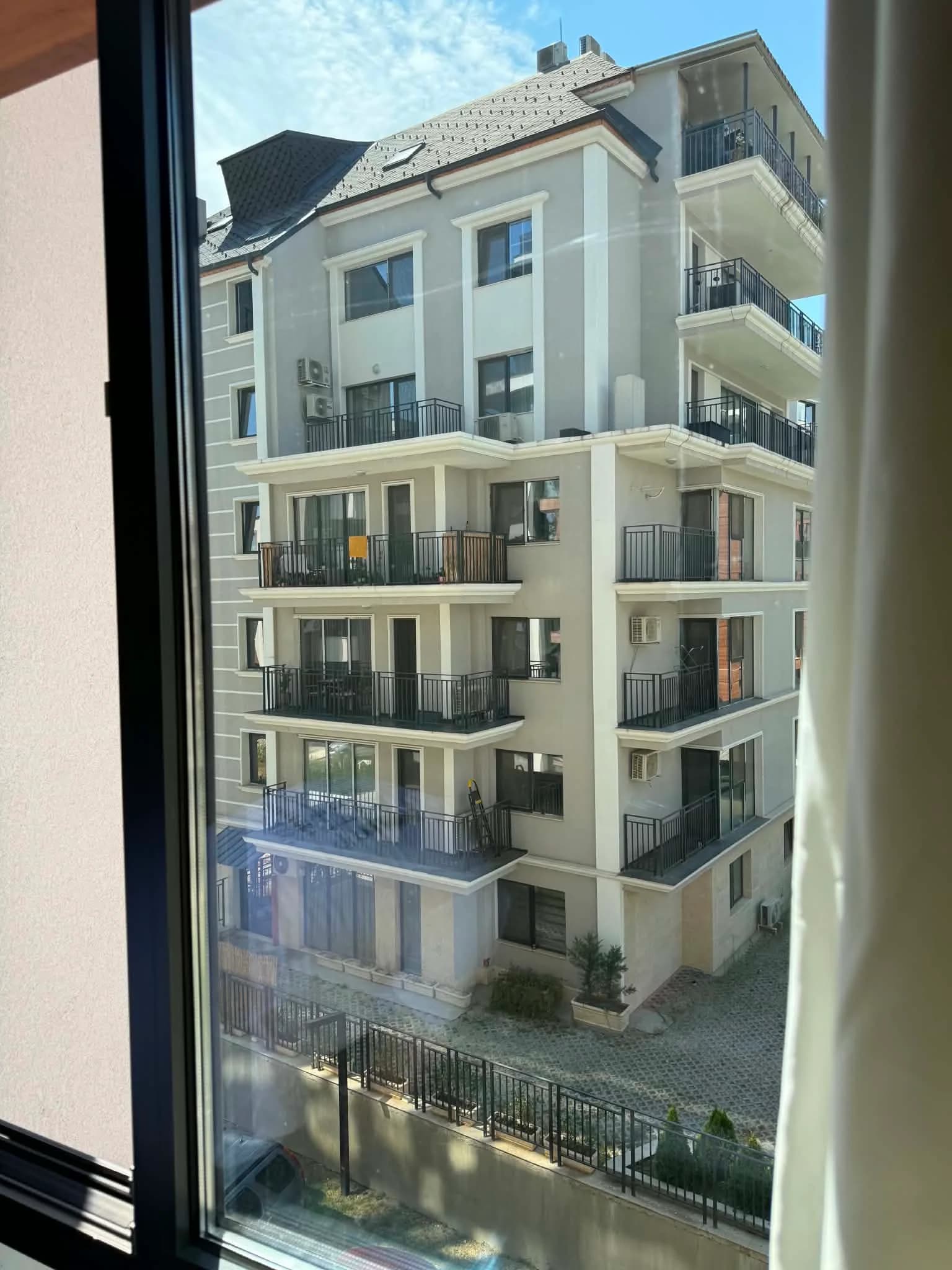 Residential window after cleaning, looking out toward a neighbouring building